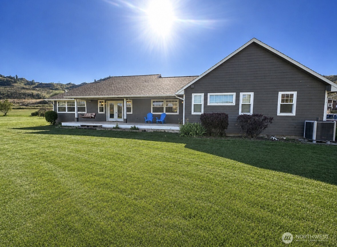 22 Rooster Flats Road Oroville, WA 98844 - Photo 26 of 28 a front view of a house with a yard