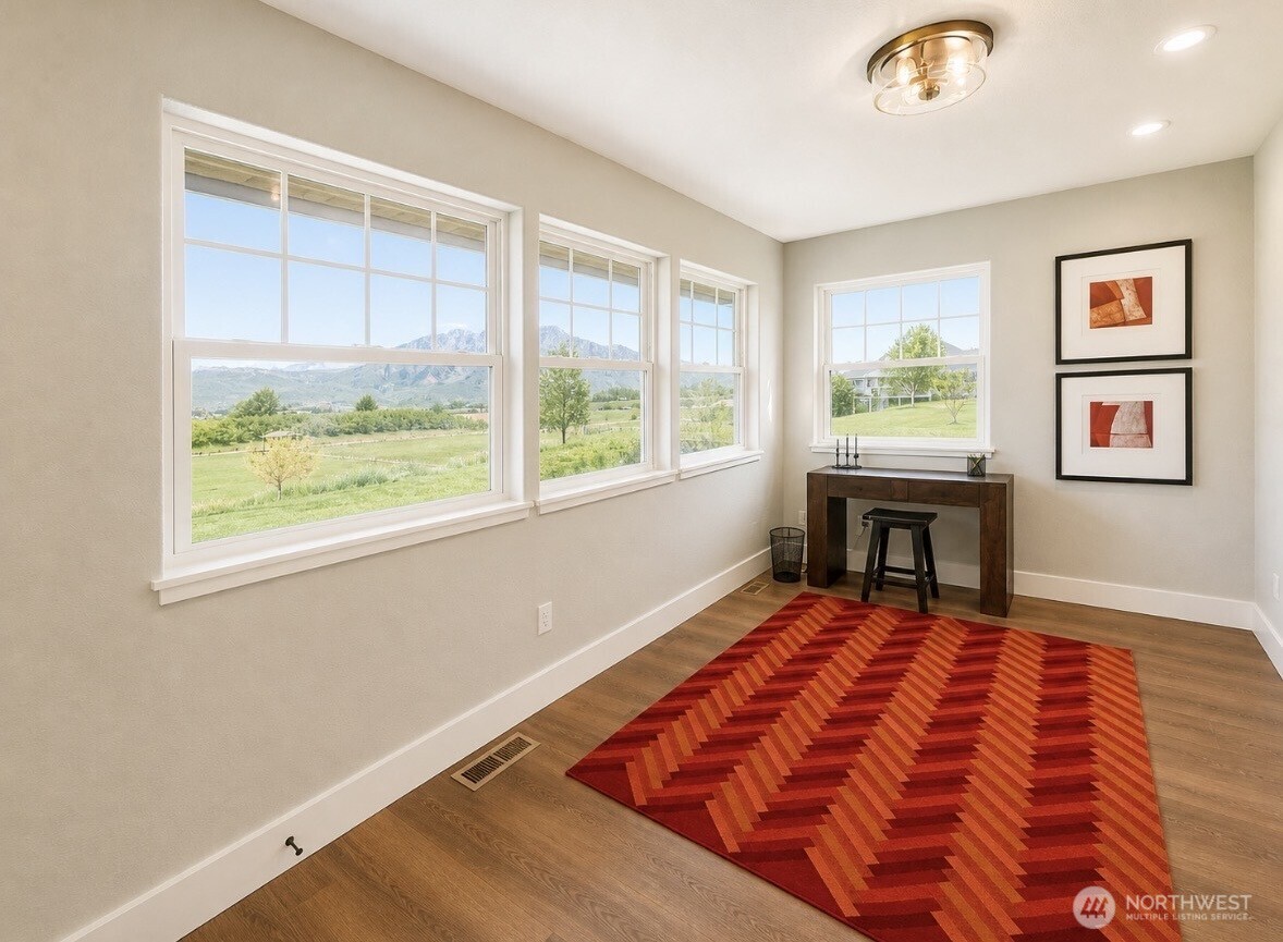 22 Rooster Flats Road Oroville, WA 98844 - Photo 8 of 28 a bed room with a bed and a window