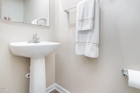 a bathroom with a sink and mirror