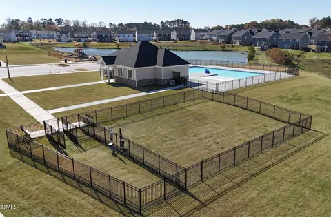 a view of a swimming pool with an outdoor seating