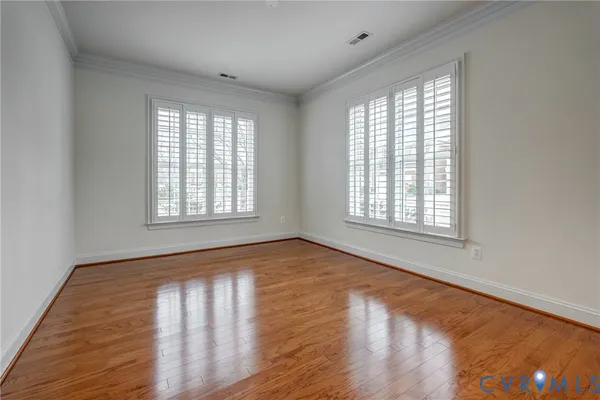 a spacious bedroom with a bed and a couch