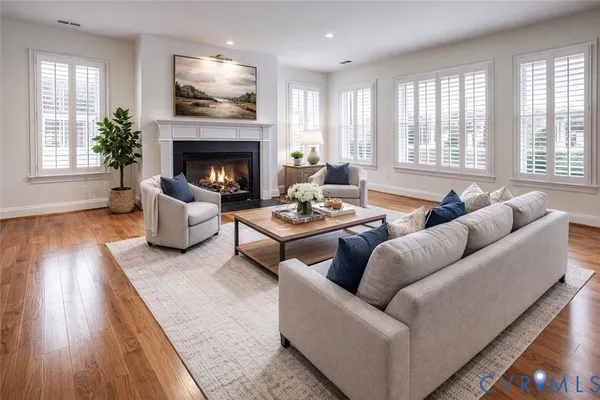 a kitchen with stainless steel appliances granite countertop a stove a sink dishwasher a refrigerator and a microwave