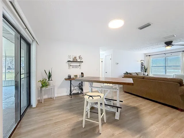 a kitchen with a table and chairs in it