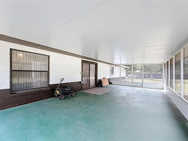 a view of a house with backyard and porch