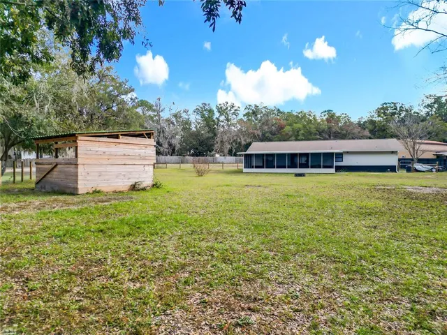 a view of swimming pool with seating area