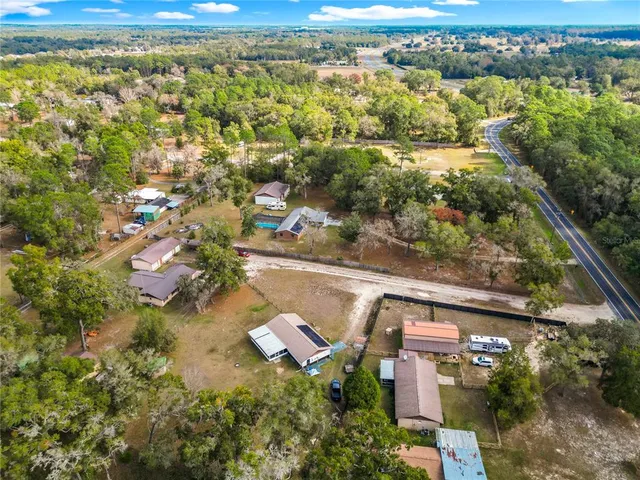 an aerial view of residential house with outdoor space