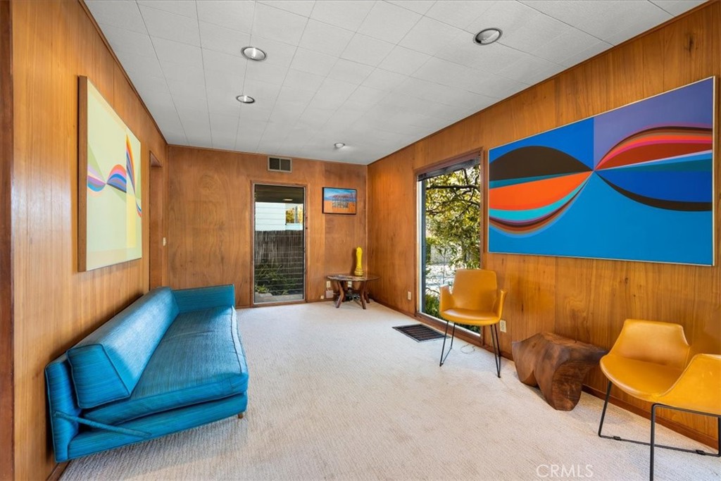 418 Sycamore Road Santa Monica, CA 90402 - Photo 13 of 43 a living room with furniture and a large window