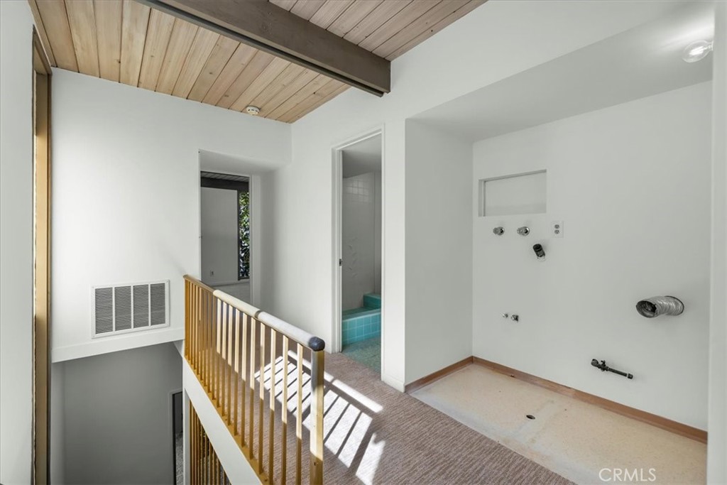 418 Sycamore Road Santa Monica, CA 90402 - Photo 22 of 43 a view of a hallway with wooden floor and windows