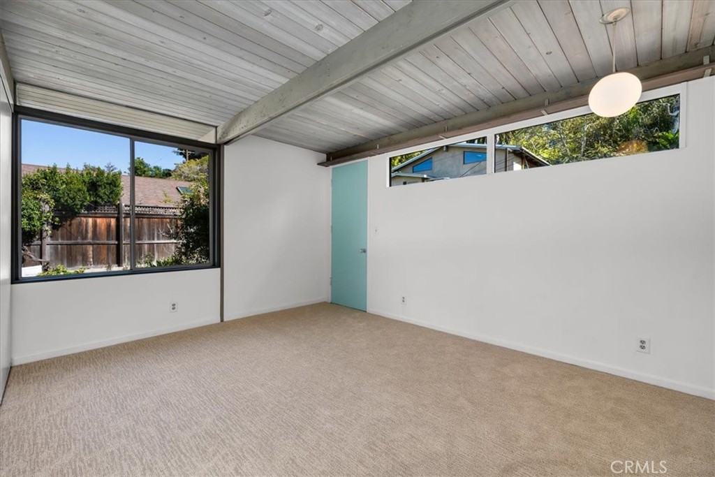 418 Sycamore Road Santa Monica, CA 90402 - Photo 30 of 43 a view of a room with a large window and chandelier fan
