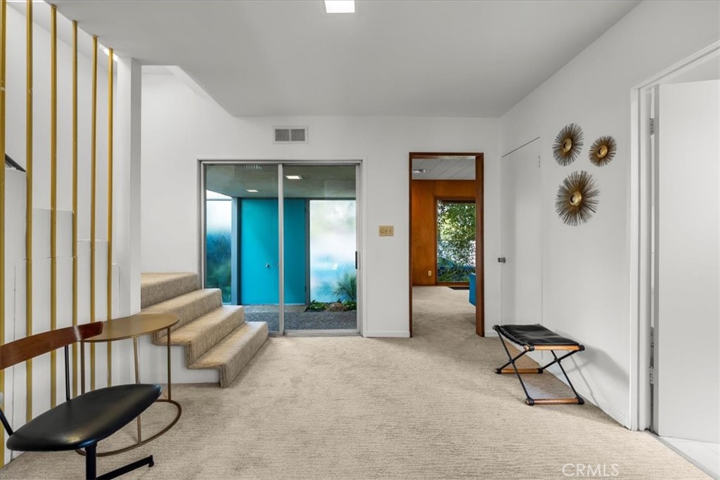 418 Sycamore Road Santa Monica, CA 90402 - Photo 5 of 43 a living room with furniture and a window