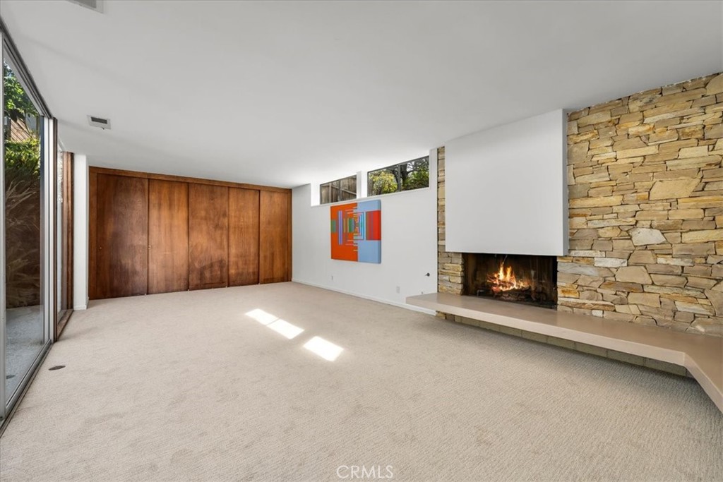 418 Sycamore Road Santa Monica, CA 90402 - Photo 10 of 43 a view of an empty room with fire place and a fireplace