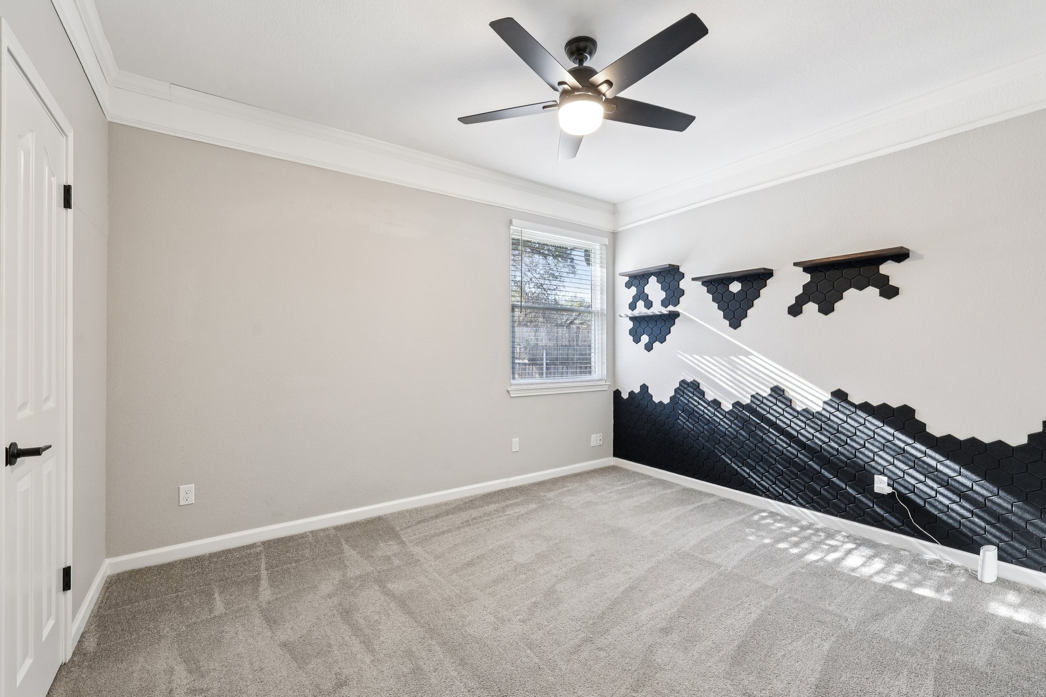 12717 Machete Trail Austin, TX 78729 - Photo 10 of 32 Carpeted empty room with crown molding and ceiling fan