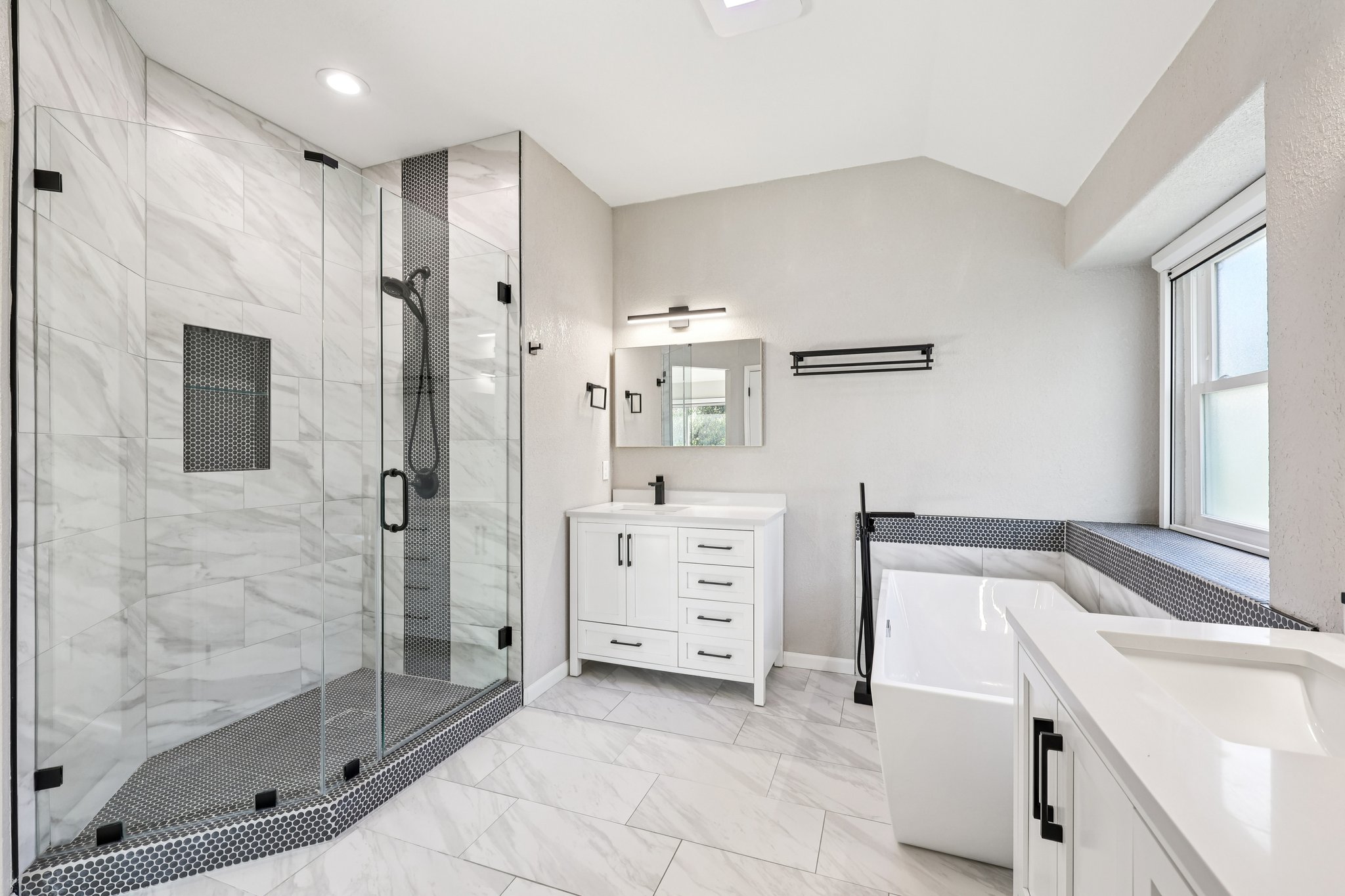 12717 Machete Trail Austin, TX 78729 - Photo 17 of 32 Full bathroom with vanity, a stall shower, light marble finish flooring, lofted ceiling, and a soaking tub