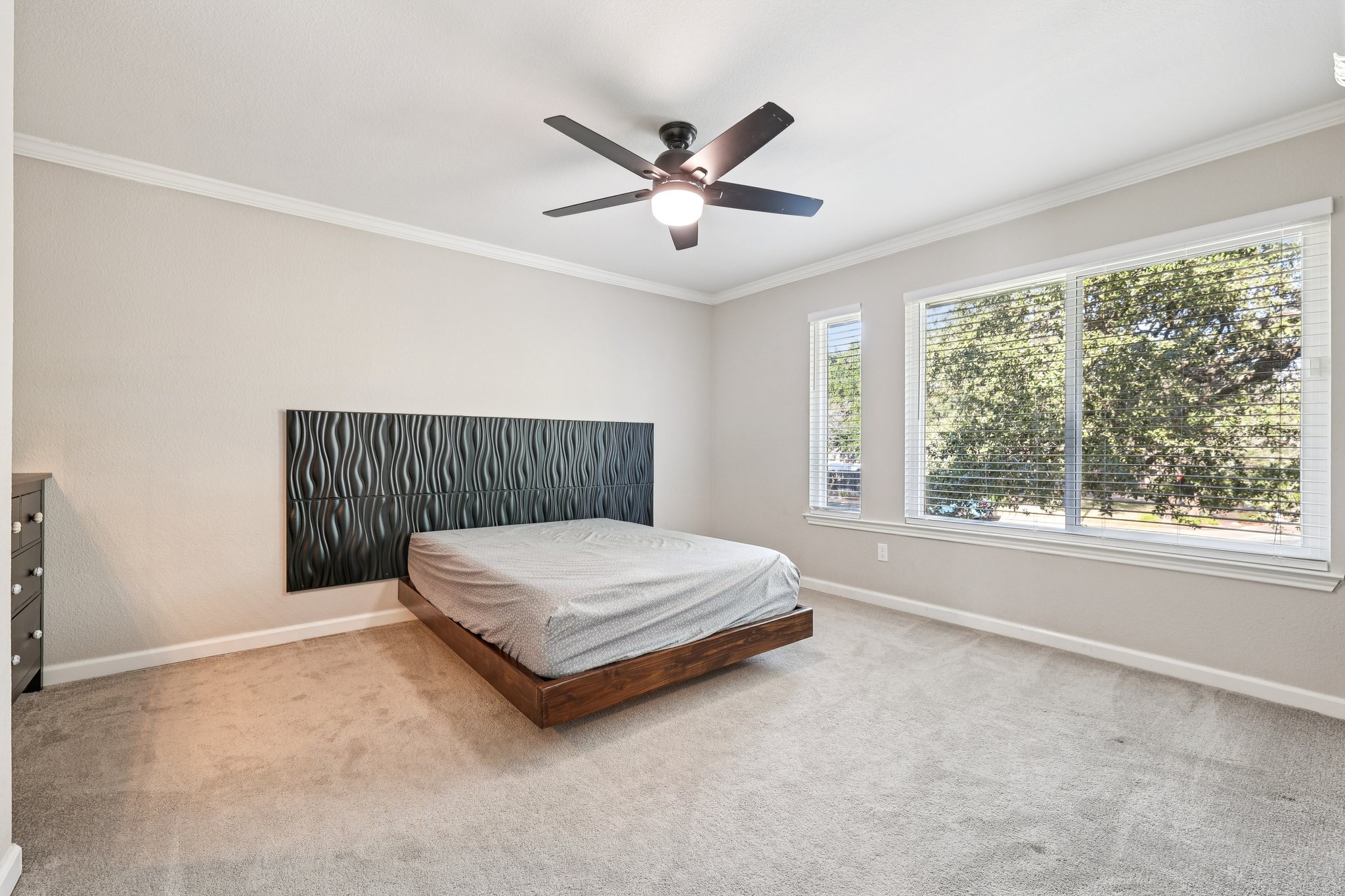 12717 Machete Trail Austin, TX 78729 - Photo 19 of 32 Bedroom with crown molding, carpet, and ceiling fan