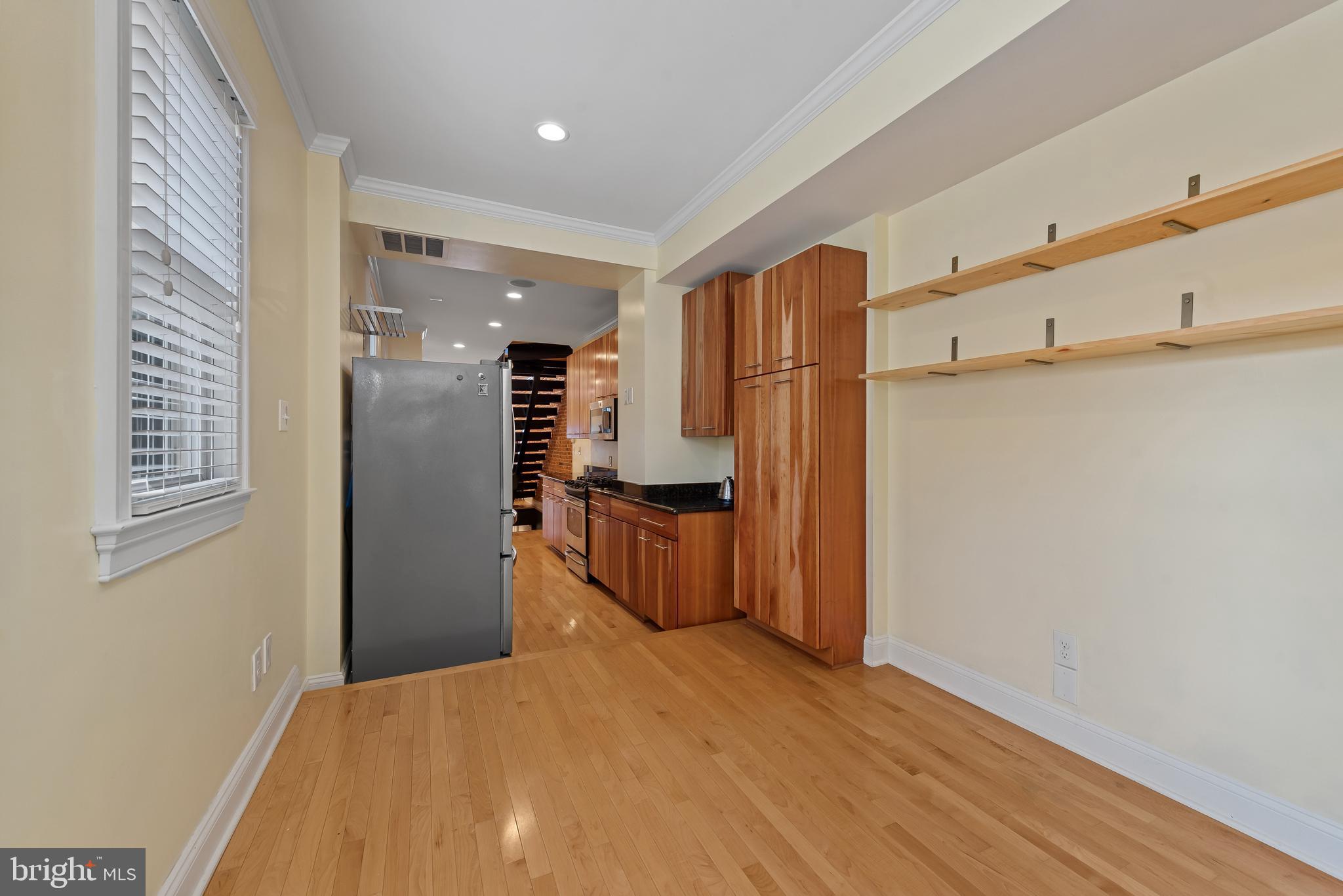 3006 Dillon Street Baltimore, MD 21224 - Photo 12 of 27 a view of empty room with wooden floor