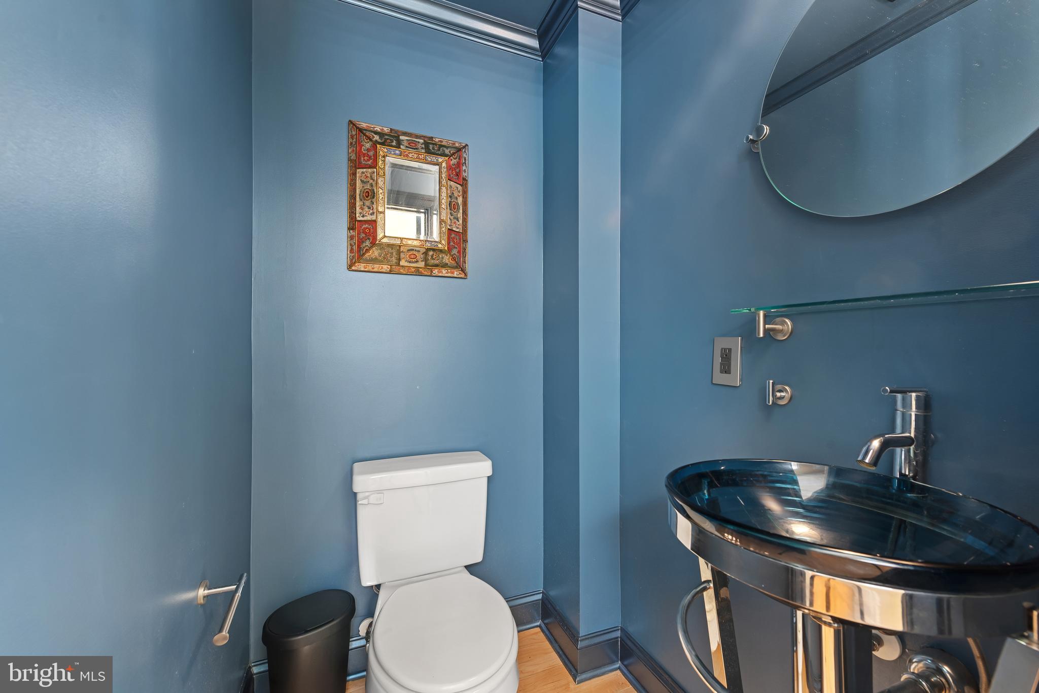 3006 Dillon Street Baltimore, MD 21224 - Photo 13 of 27 a bathroom with a toilet and a sink