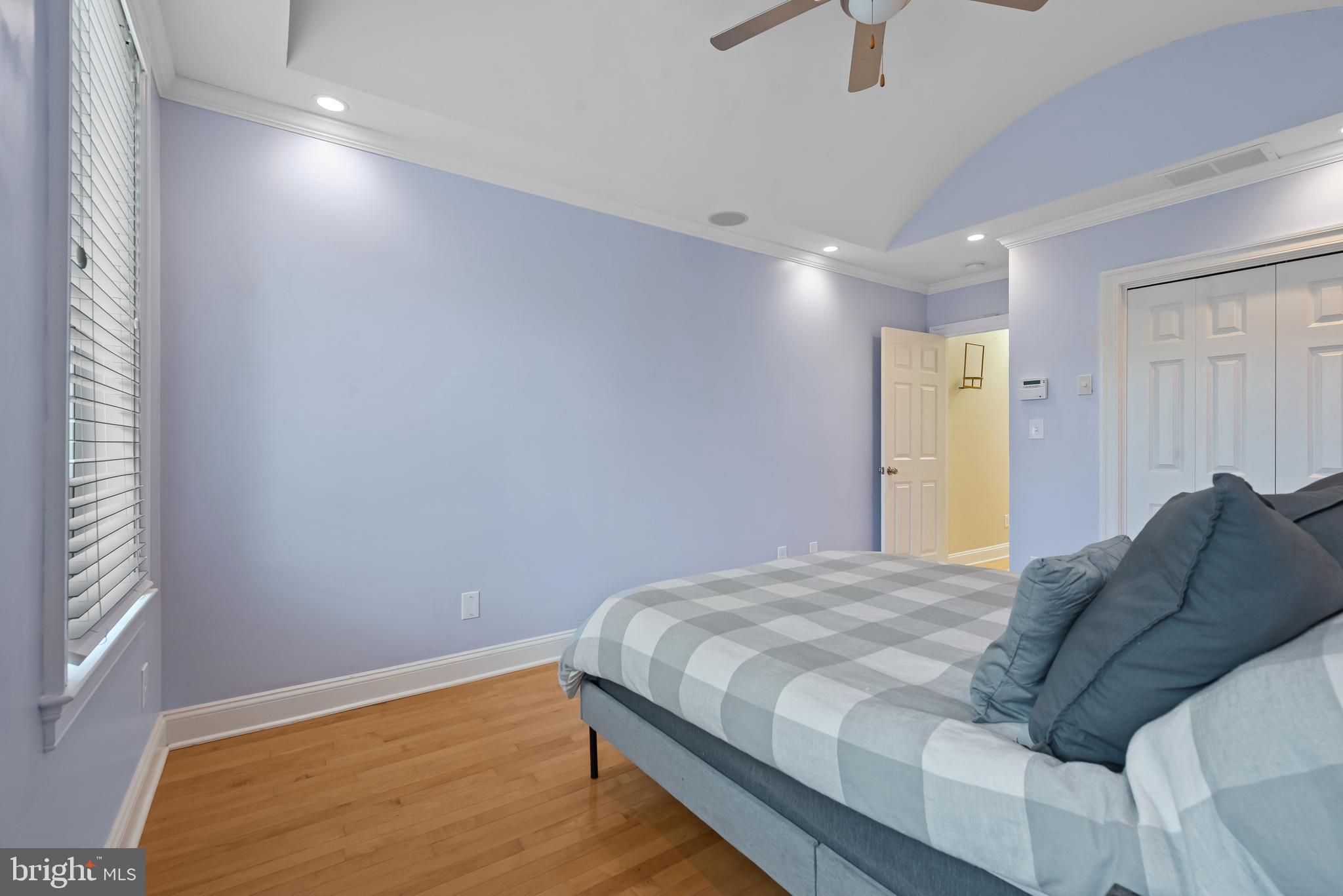 3006 Dillon Street Baltimore, MD 21224 - Photo 16 of 27 a bedroom with a bed and a window