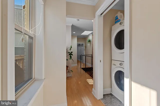 a view of a hallway with washer and dryer