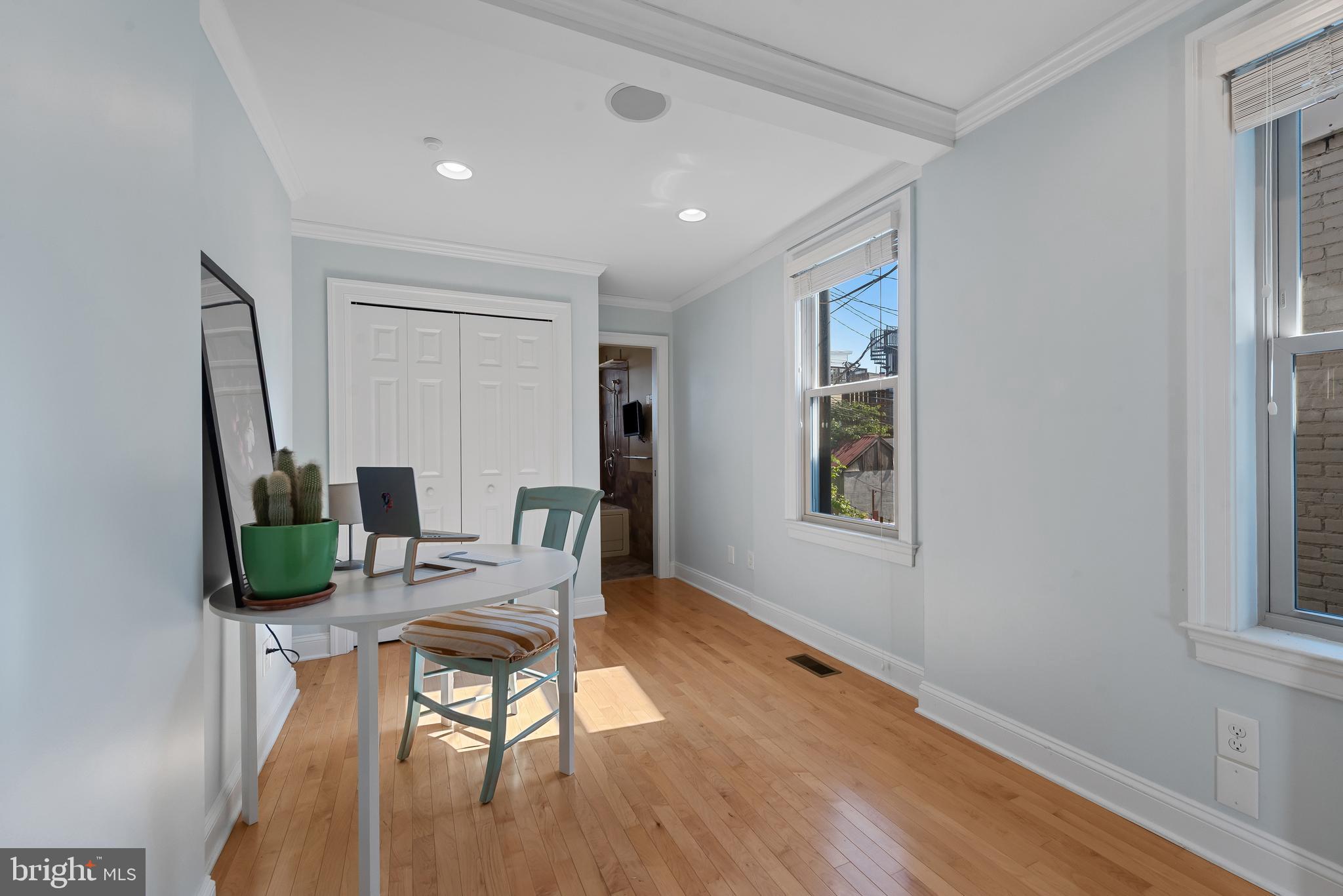 3006 Dillon Street Baltimore, MD 21224 - Photo 21 of 27 a workspace room with furniture and wooden floor