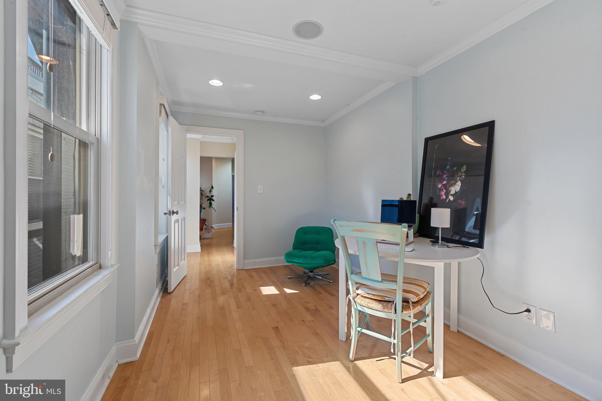 3006 Dillon Street Baltimore, MD 21224 - Photo 22 of 27 a workspace with wooden floor and windows