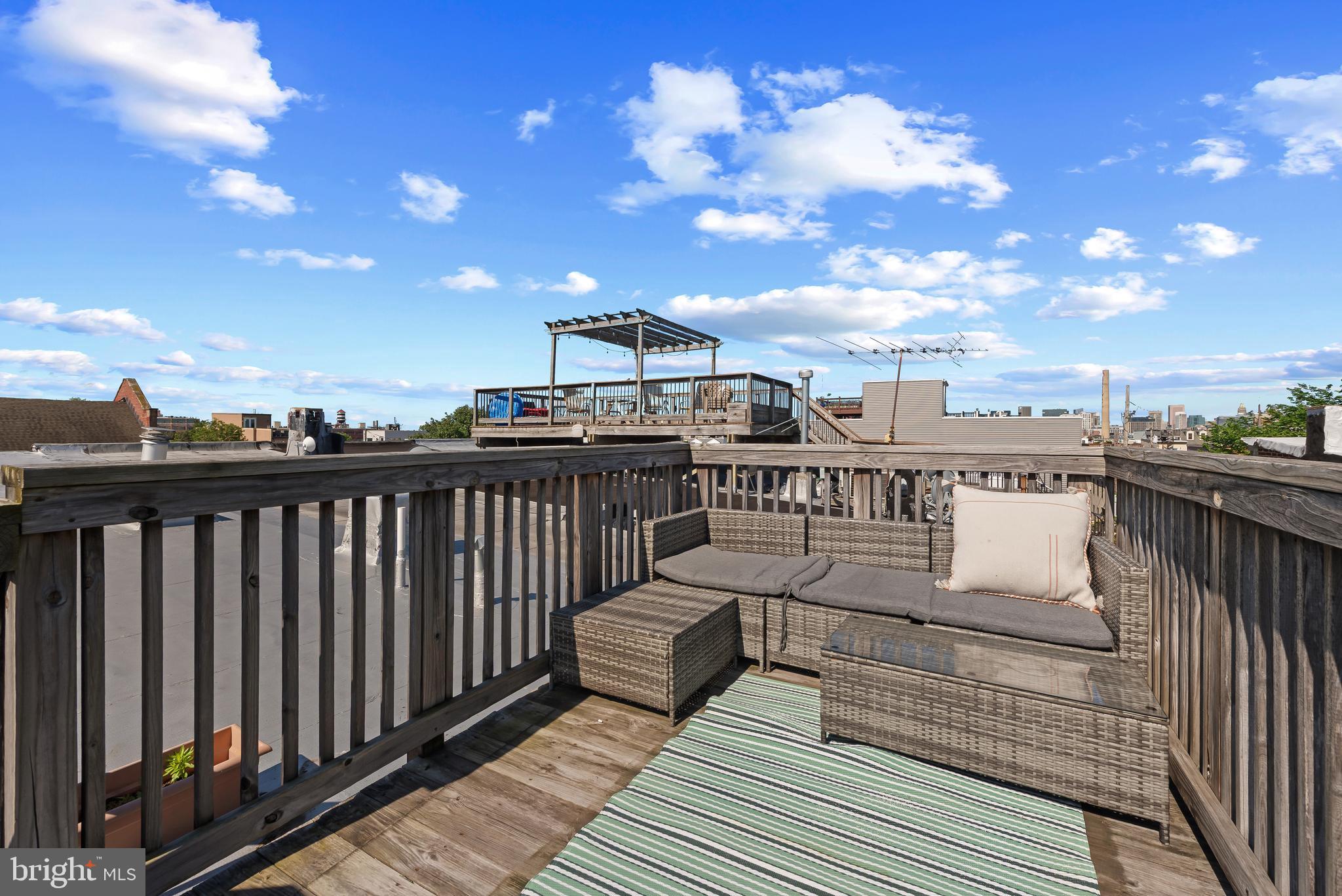 3006 Dillon Street Baltimore, MD 21224 - Photo 27 of 27 a view of a balcony with wooden floor