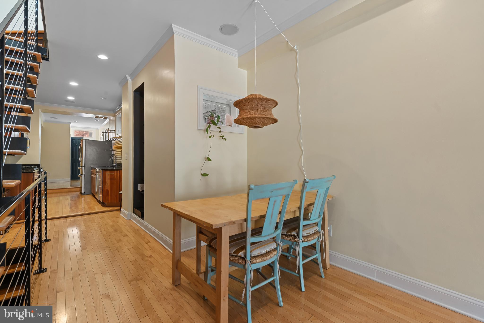 3006 Dillon Street Baltimore, MD 21224 - Photo 7 of 27 a dining room with furniture and wooden floor