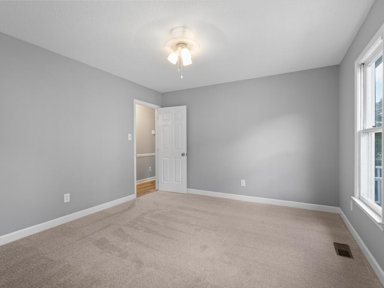 3608 Iron Sight Court Raleigh, NC 27616 - Photo 11 of 36 a view of an empty room with a window