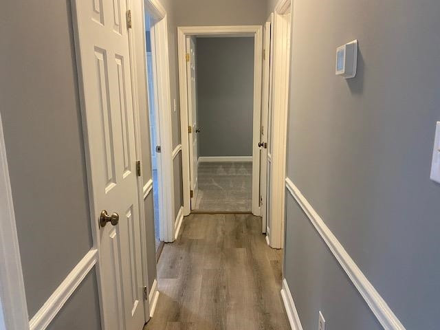 3608 Iron Sight Court Raleigh, NC 27616 - Photo 15 of 36 a view of a hallway with wooden floor and staircase