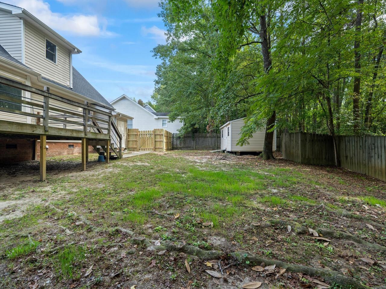 3608 Iron Sight Court Raleigh, NC 27616 - Photo 25 of 36 a view of a house with backyard and a tree