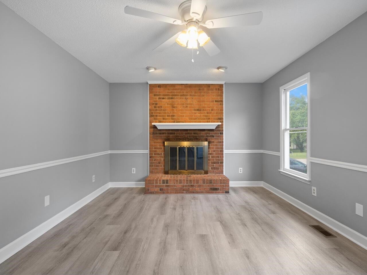 3608 Iron Sight Court Raleigh, NC 27616 - Photo 4 of 36 wooden floor in an empty room with a window