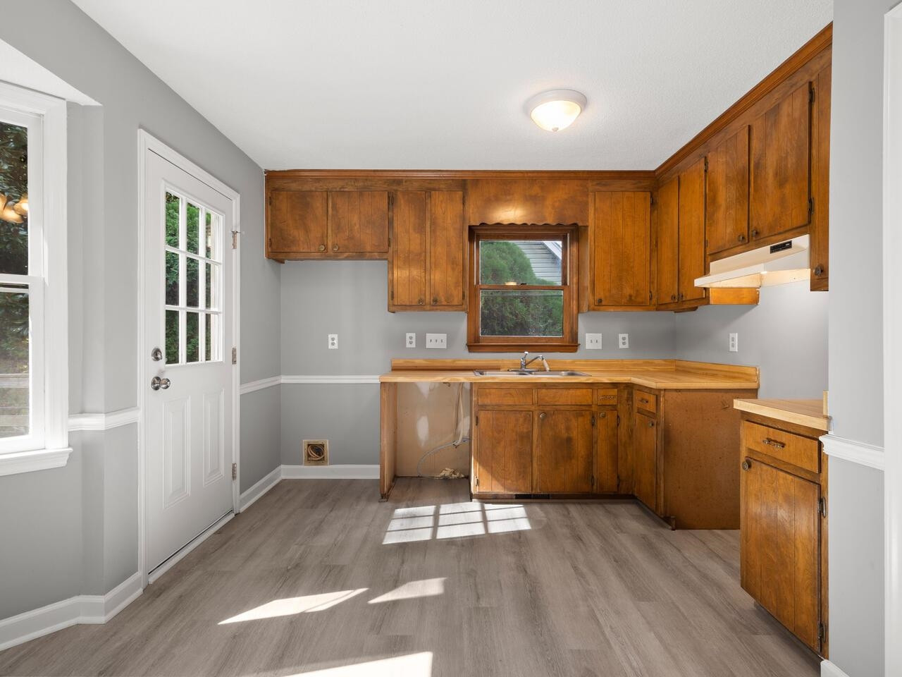 3608 Iron Sight Court Raleigh, NC 27616 - Photo 8 of 36 a kitchen with a sink cabinets and wooden floor