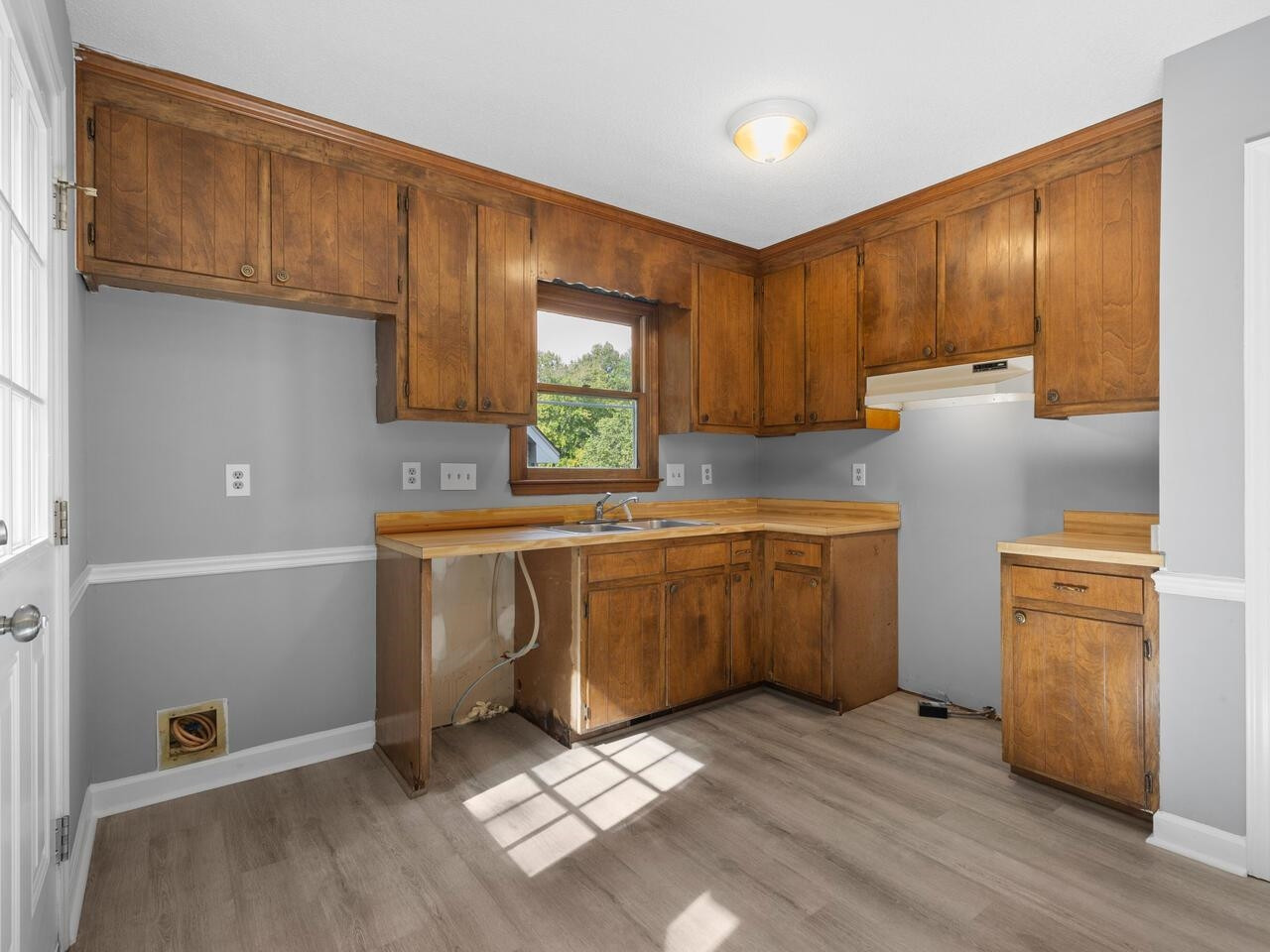 3608 Iron Sight Court Raleigh, NC 27616 - Photo 9 of 36 a kitchen with a refrigerator sink and cabinets