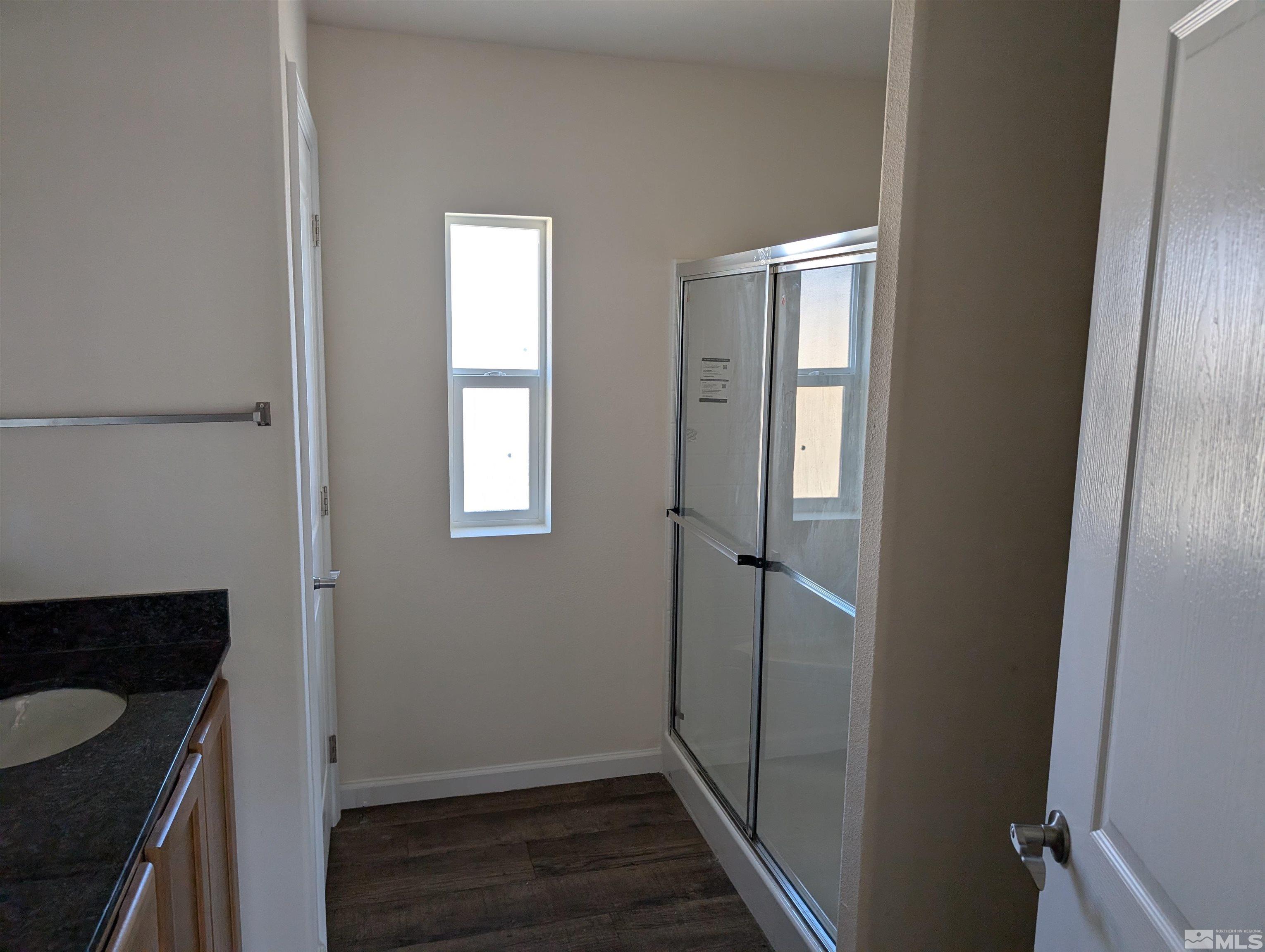 520 Matterhorn Boulevard Reno, NV 89506 - Photo 11 of 11 a bathroom with a sink and a mirror