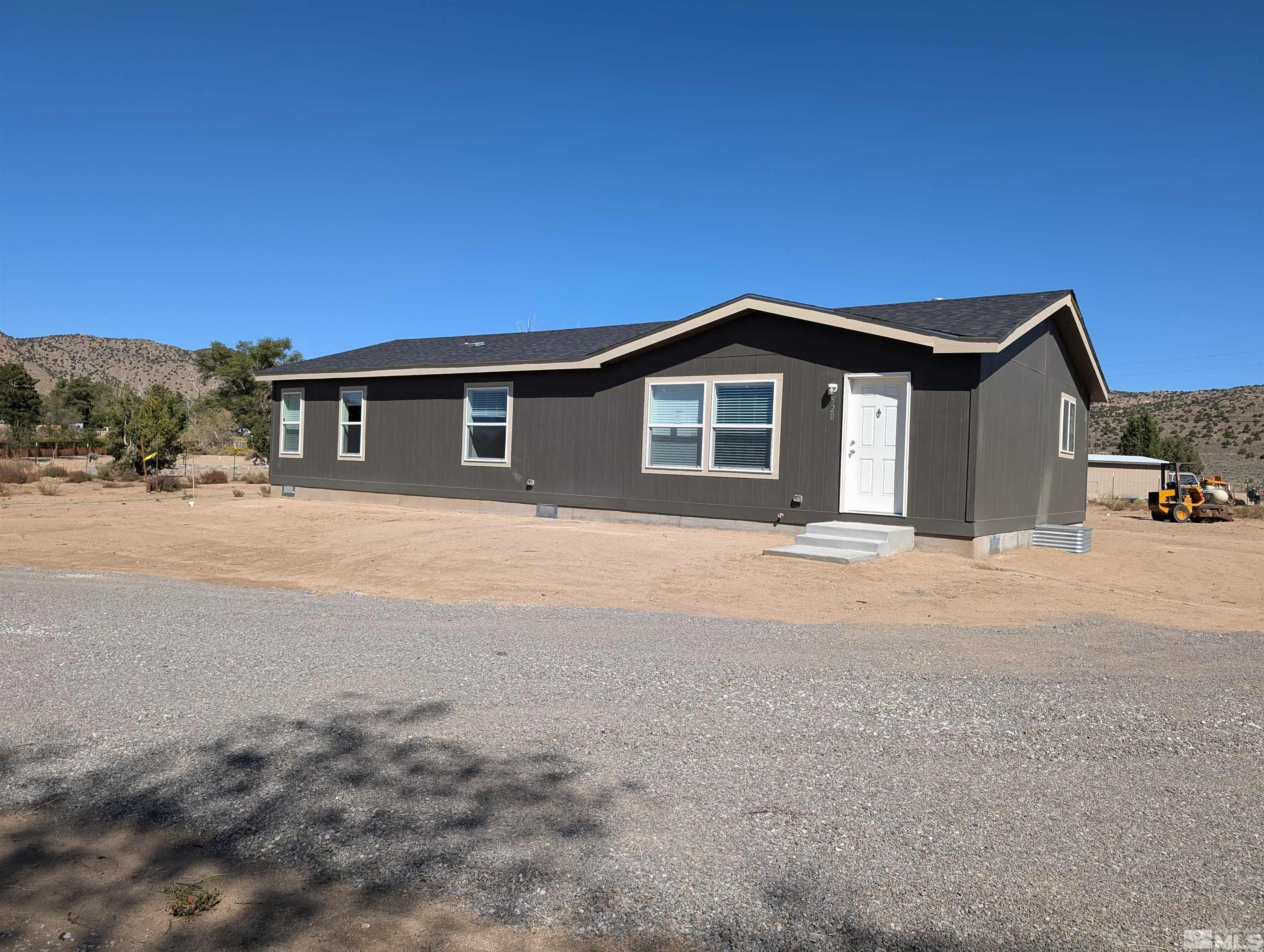520 Matterhorn Boulevard Reno, NV 89506 - Photo 2 of 11 a front view of a house with a yard