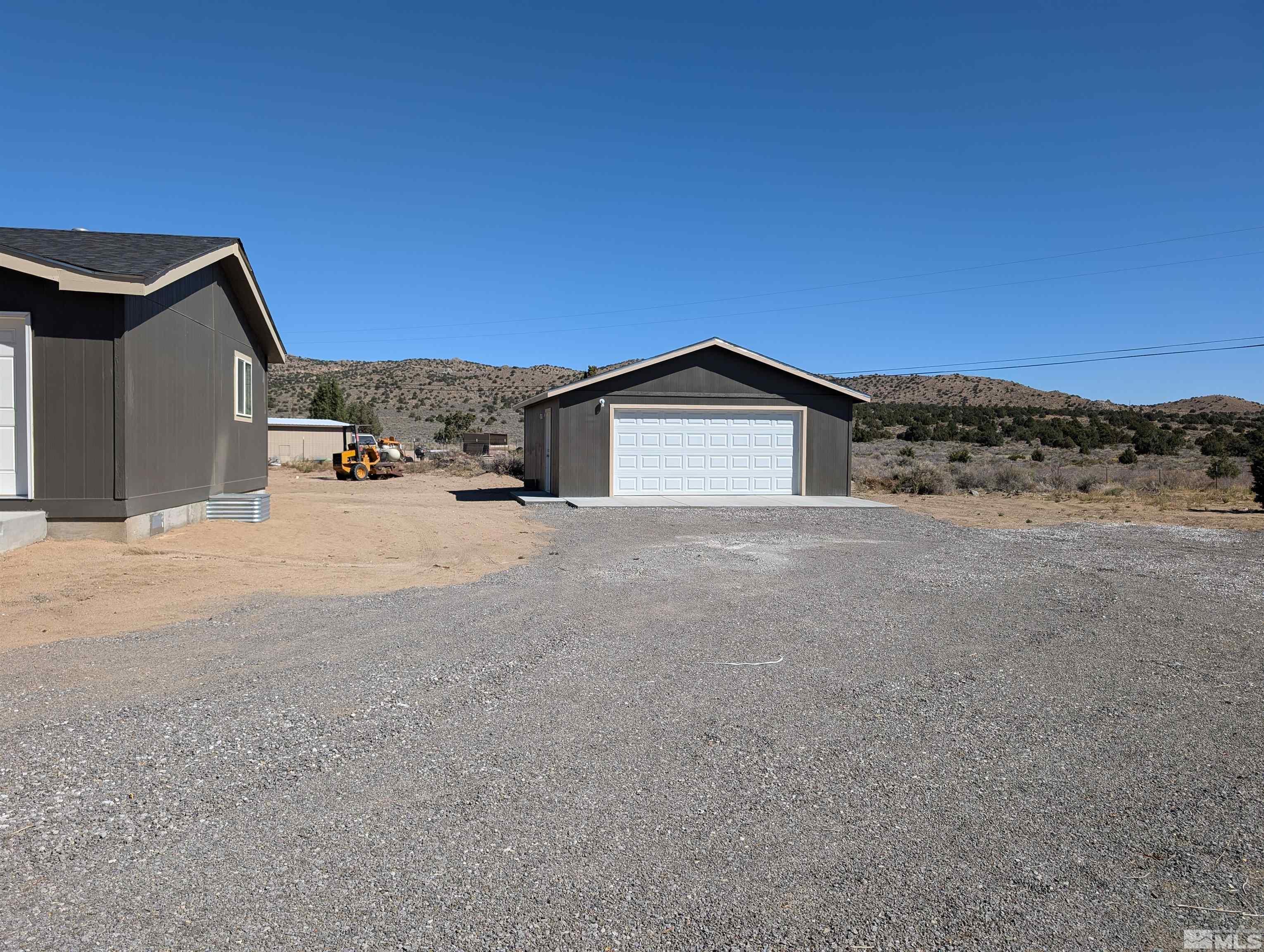 520 Matterhorn Boulevard Reno, NV 89506 - Photo 3 of 11 a view of the house with a yard and a large parking space