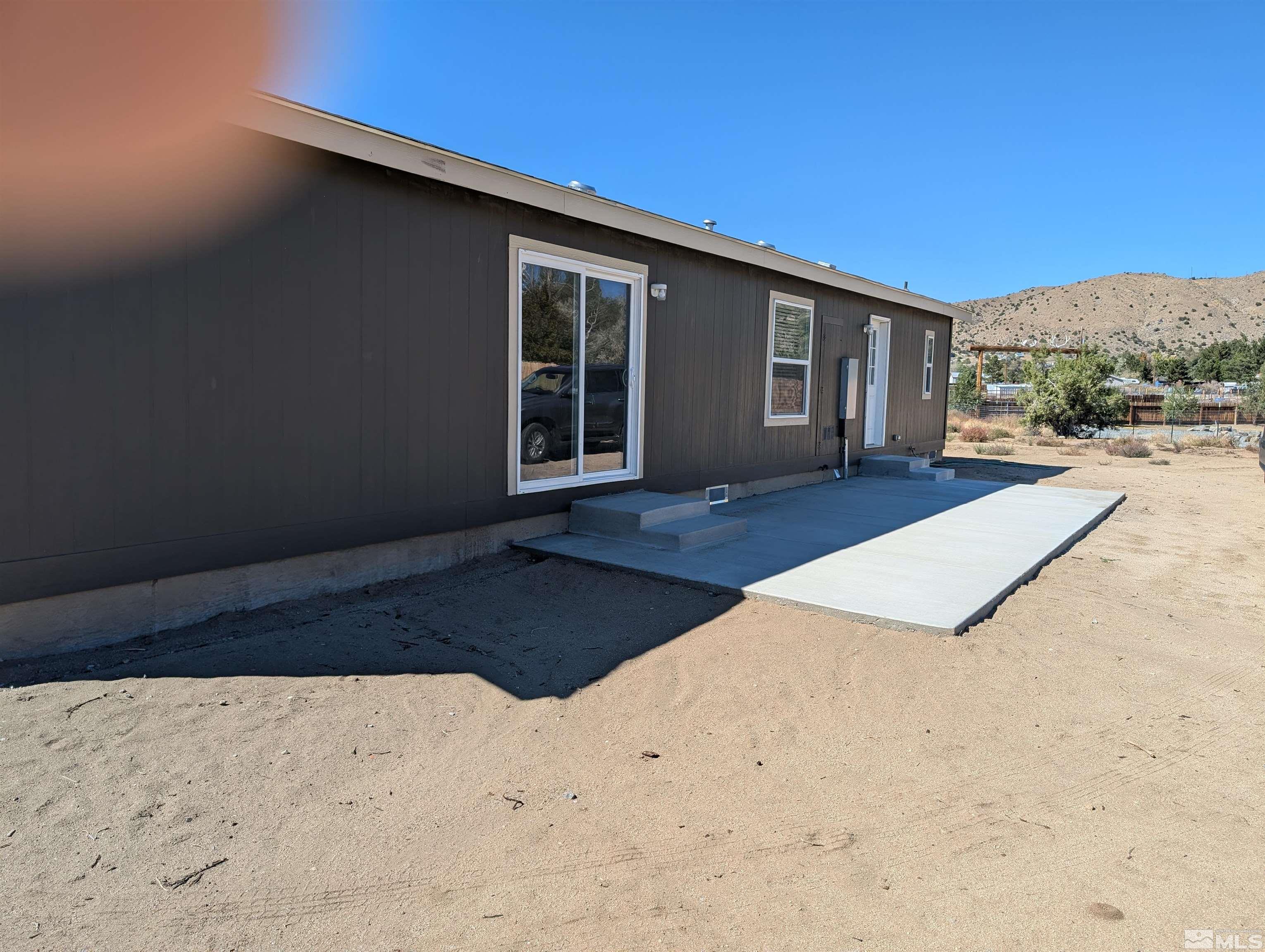 520 Matterhorn Boulevard Reno, NV 89506 - Photo 5 of 11 a front view of a house with a yard