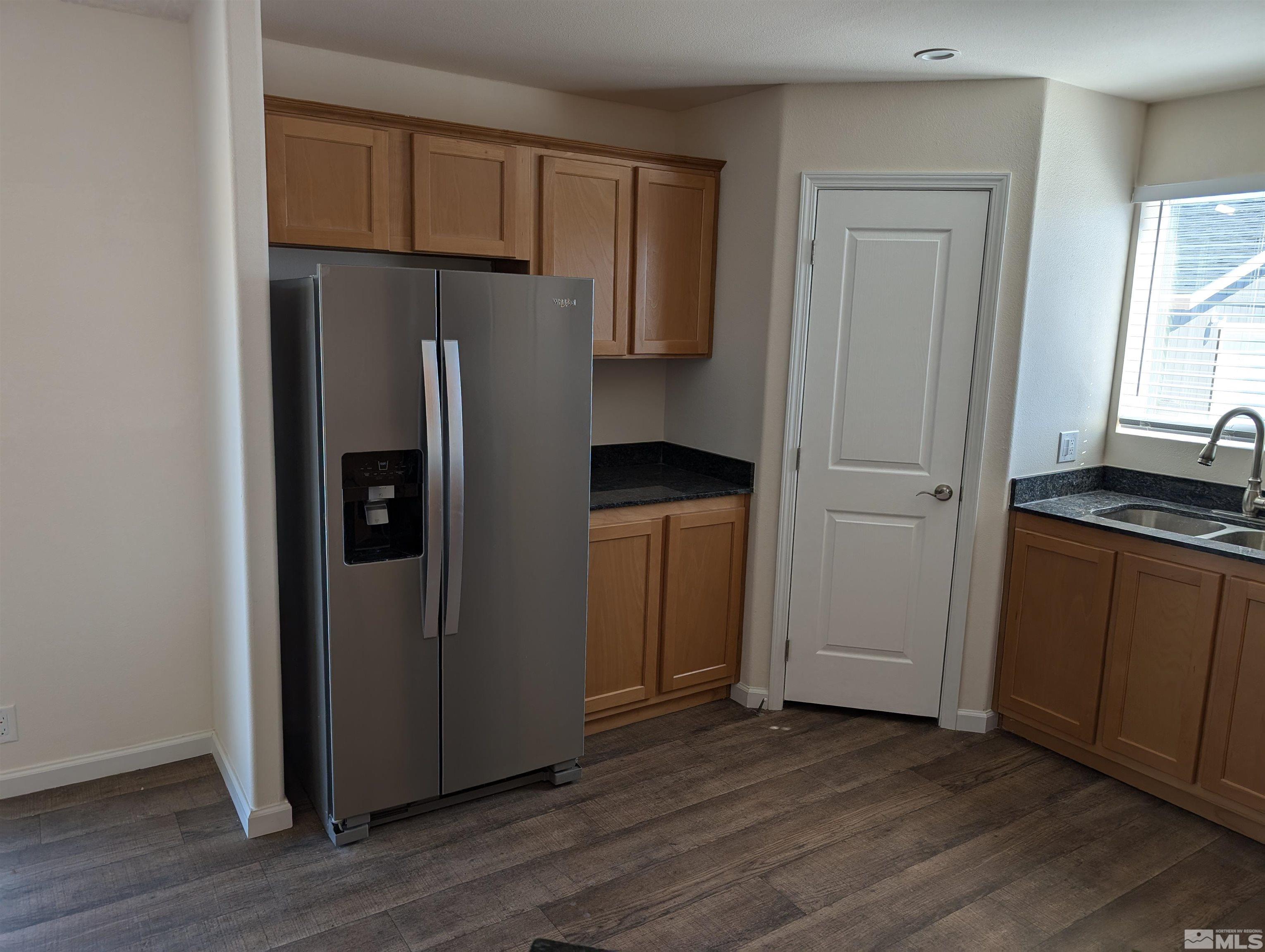 520 Matterhorn Boulevard Reno, NV 89506 - Photo 7 of 11 a kitchen with a refrigerator and cabinets