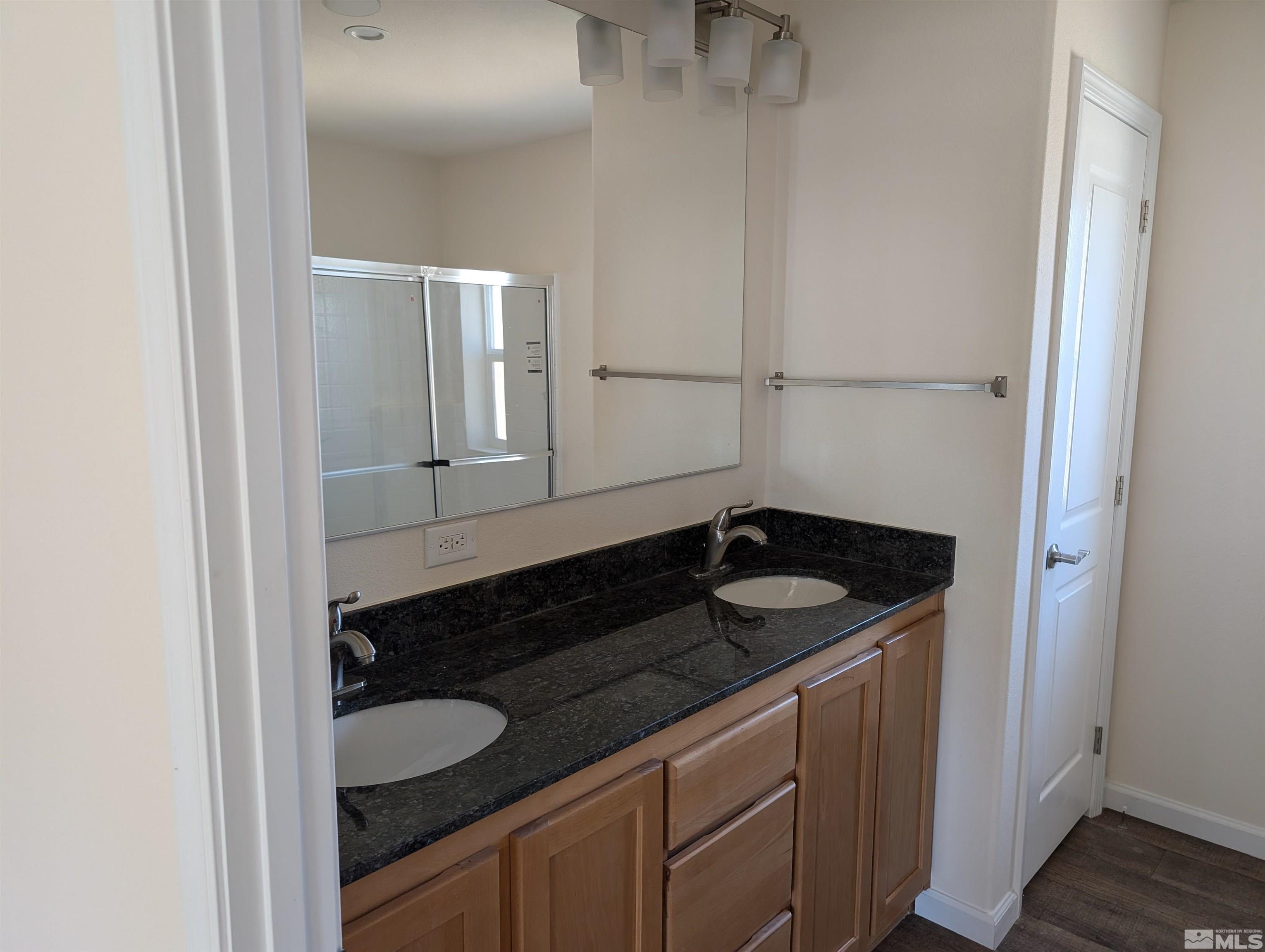520 Matterhorn Boulevard Reno, NV 89506 - Photo 10 of 11 a bathroom with a sink and a mirror