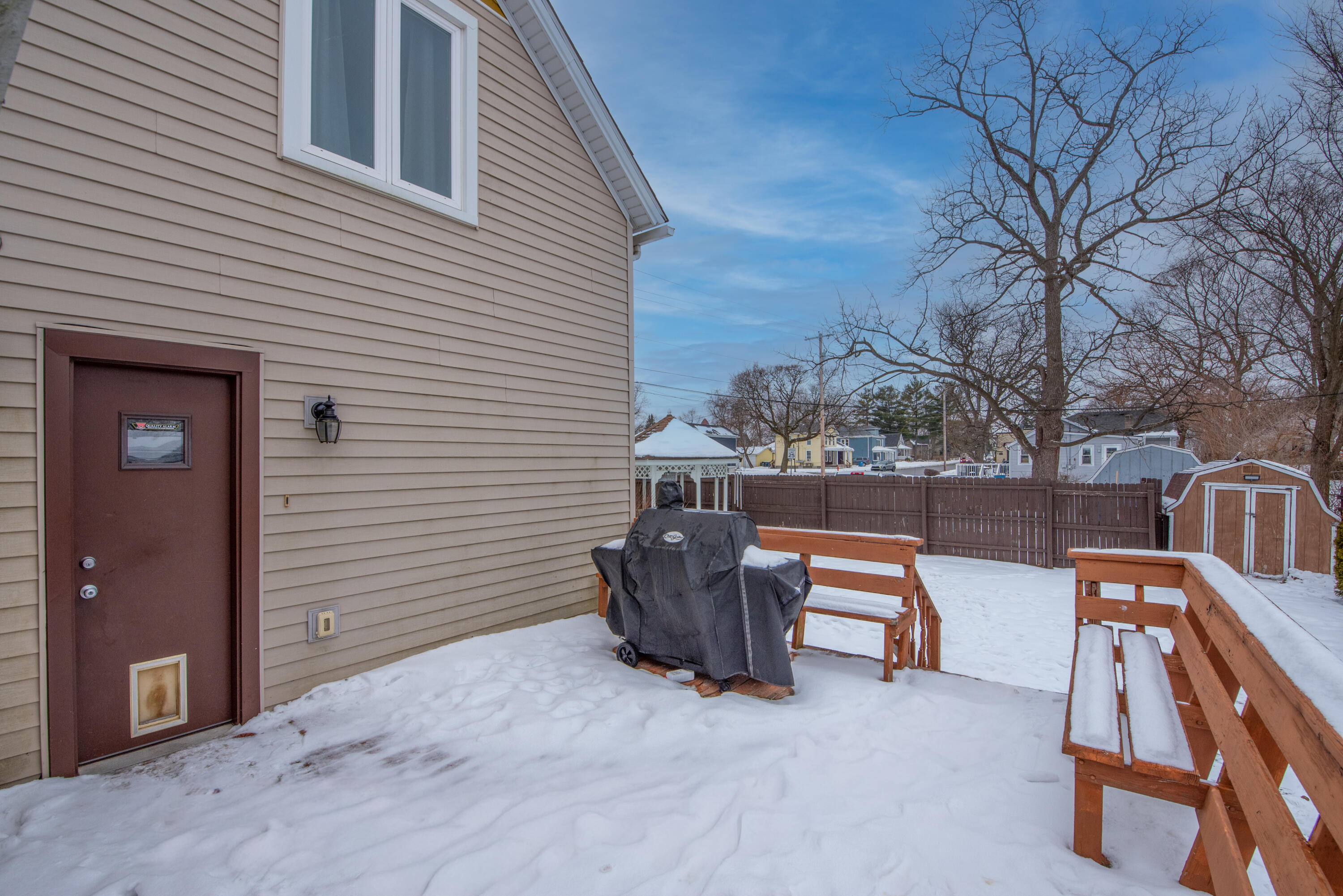 516 East North Street Crown Point, IN 46307 - Photo 20 of 20 a view of a patio with a table and chairs and a barbeque