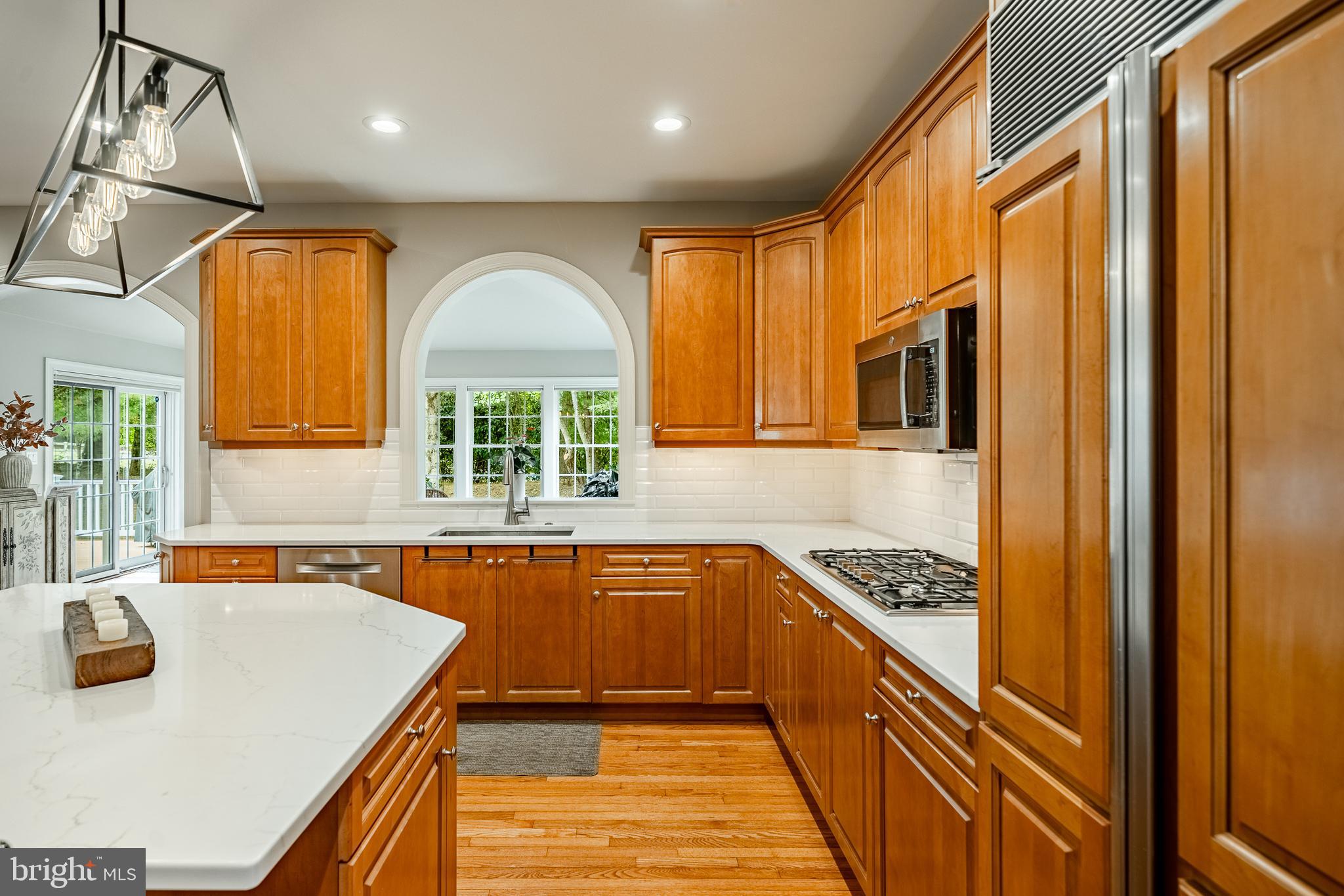 37 Ruth Circle Malvern, PA 19355 - Photo 15 of 63 a kitchen with stainless steel appliances granite countertop a sink a stove and a refrigerator