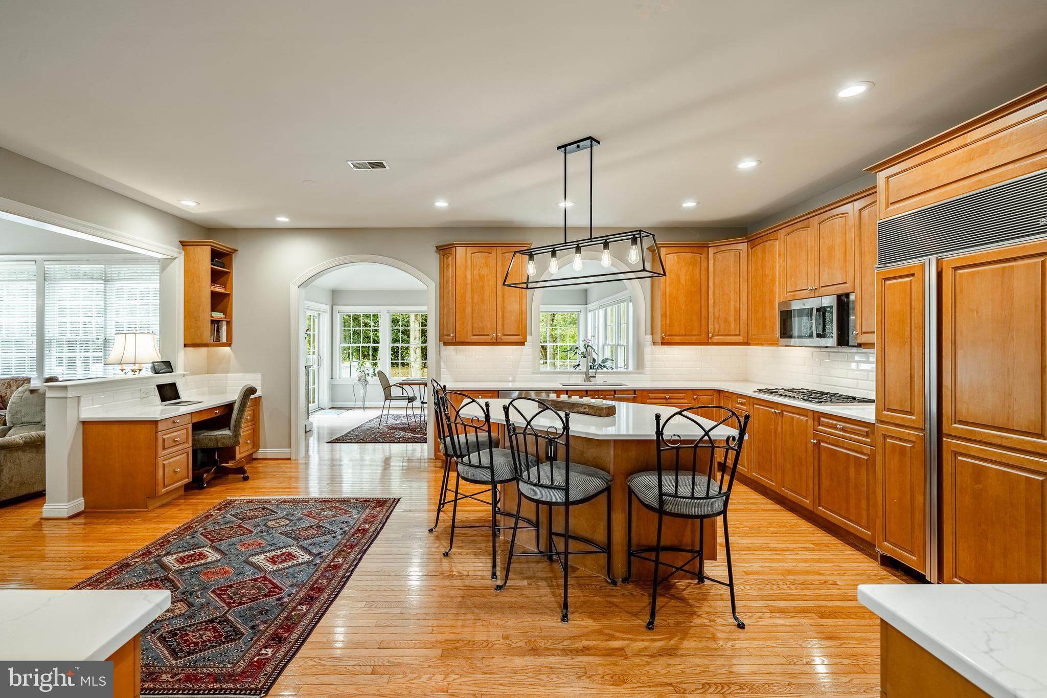37 Ruth Circle Malvern, PA 19355 - Photo 16 of 63 a kitchen with stainless steel appliances granite countertop a sink a stove a refrigerator dining table and chairs