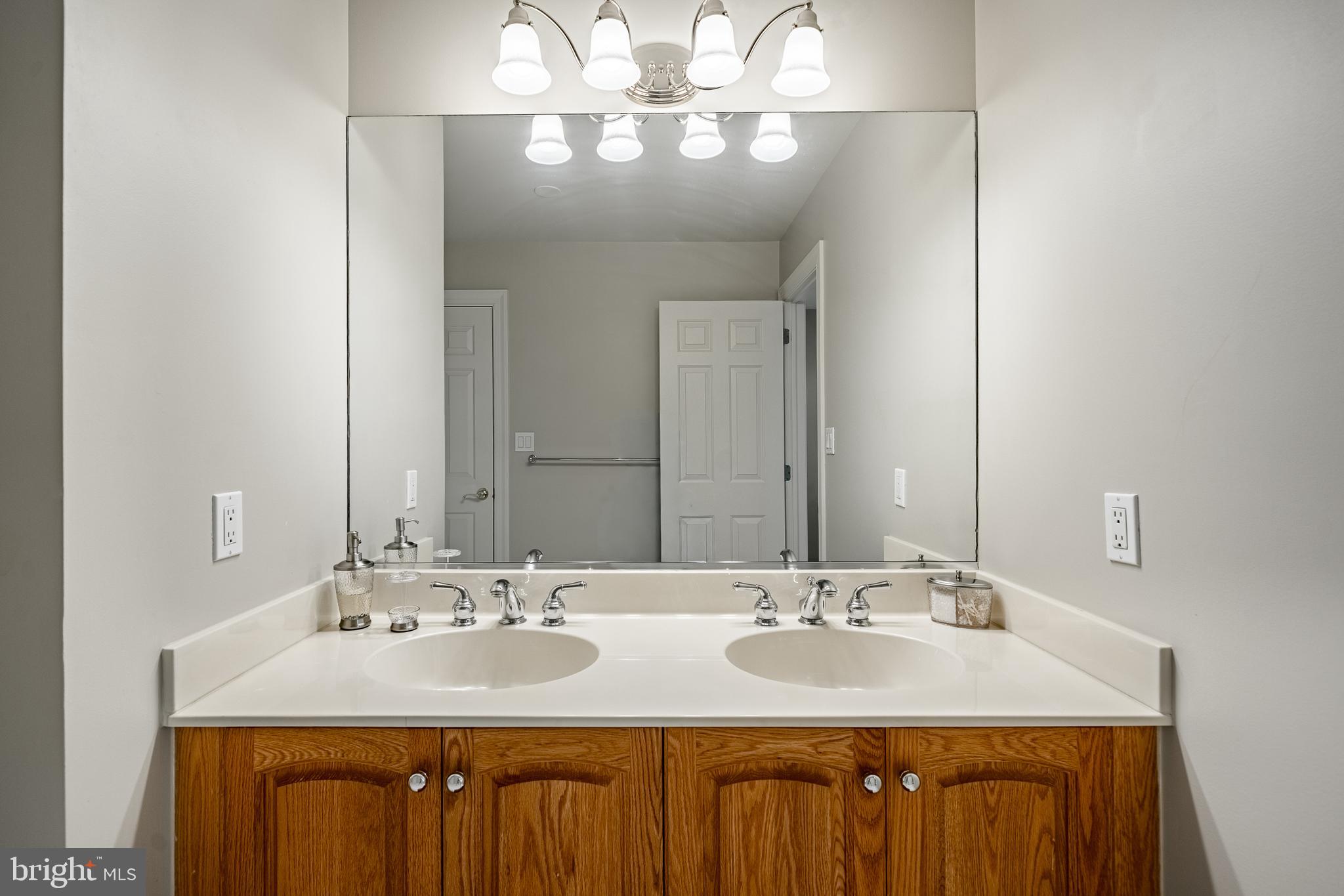 37 Ruth Circle Malvern, PA 19355 - Photo 39 of 63 a bathroom with a granite countertop sink and a mirror