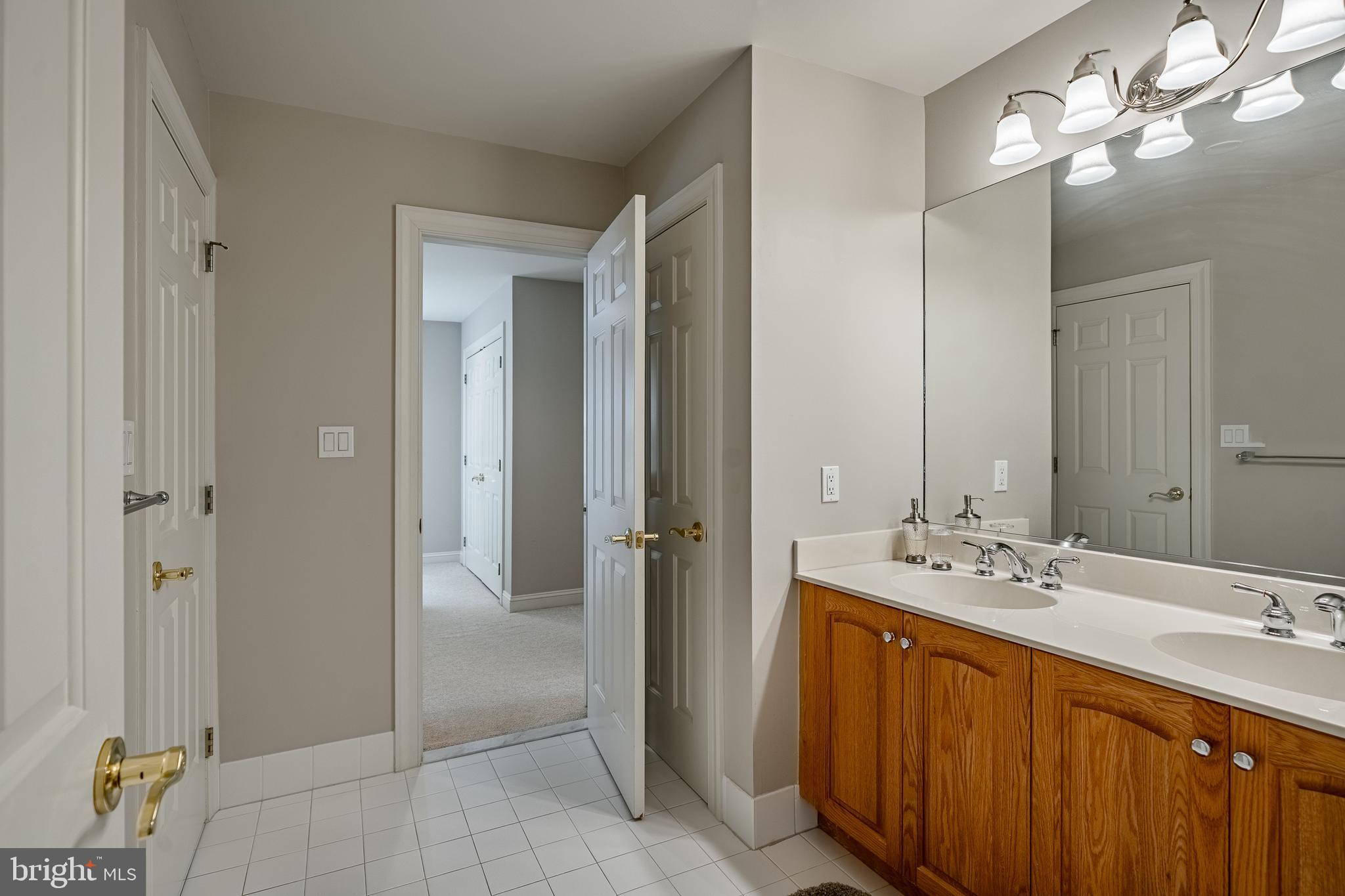37 Ruth Circle Malvern, PA 19355 - Photo 46 of 63 a bathroom with a double vanity sink and a mirror