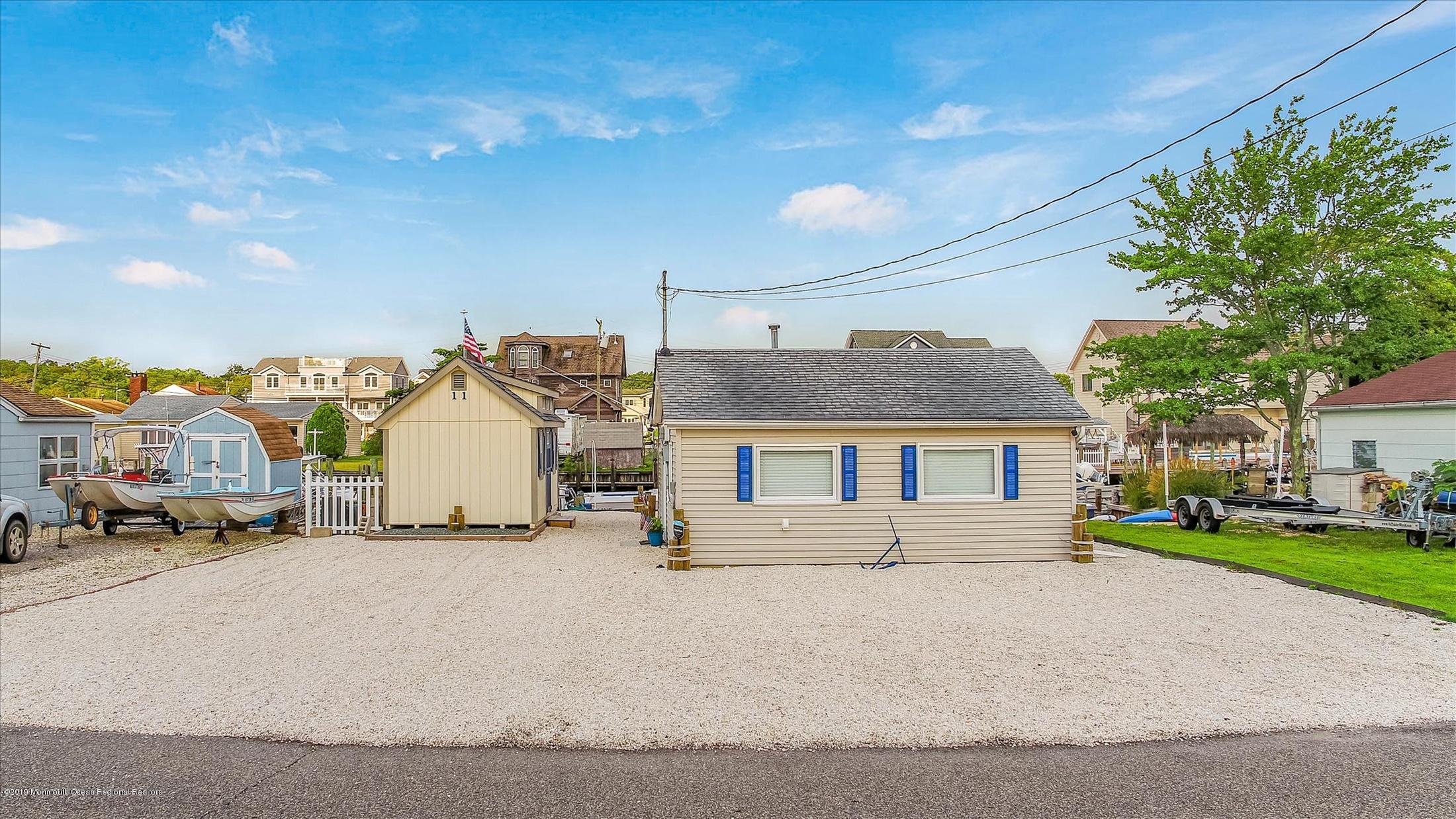 11 Compass Road Waretown, NJ 08758 - Photo 1 of 38 a view of a house with a patio