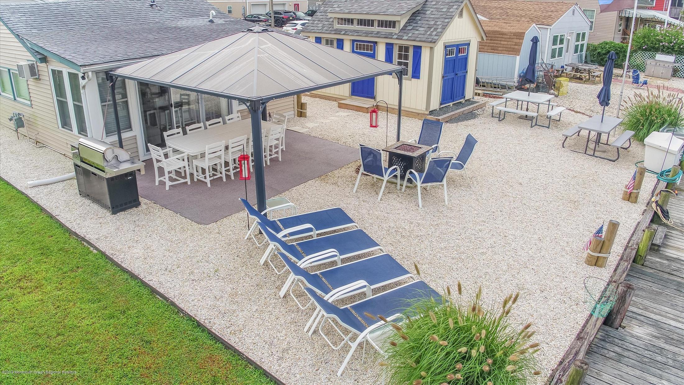 11 Compass Road Waretown, NJ 08758 - Photo 21 of 38 an outdoor space with patio