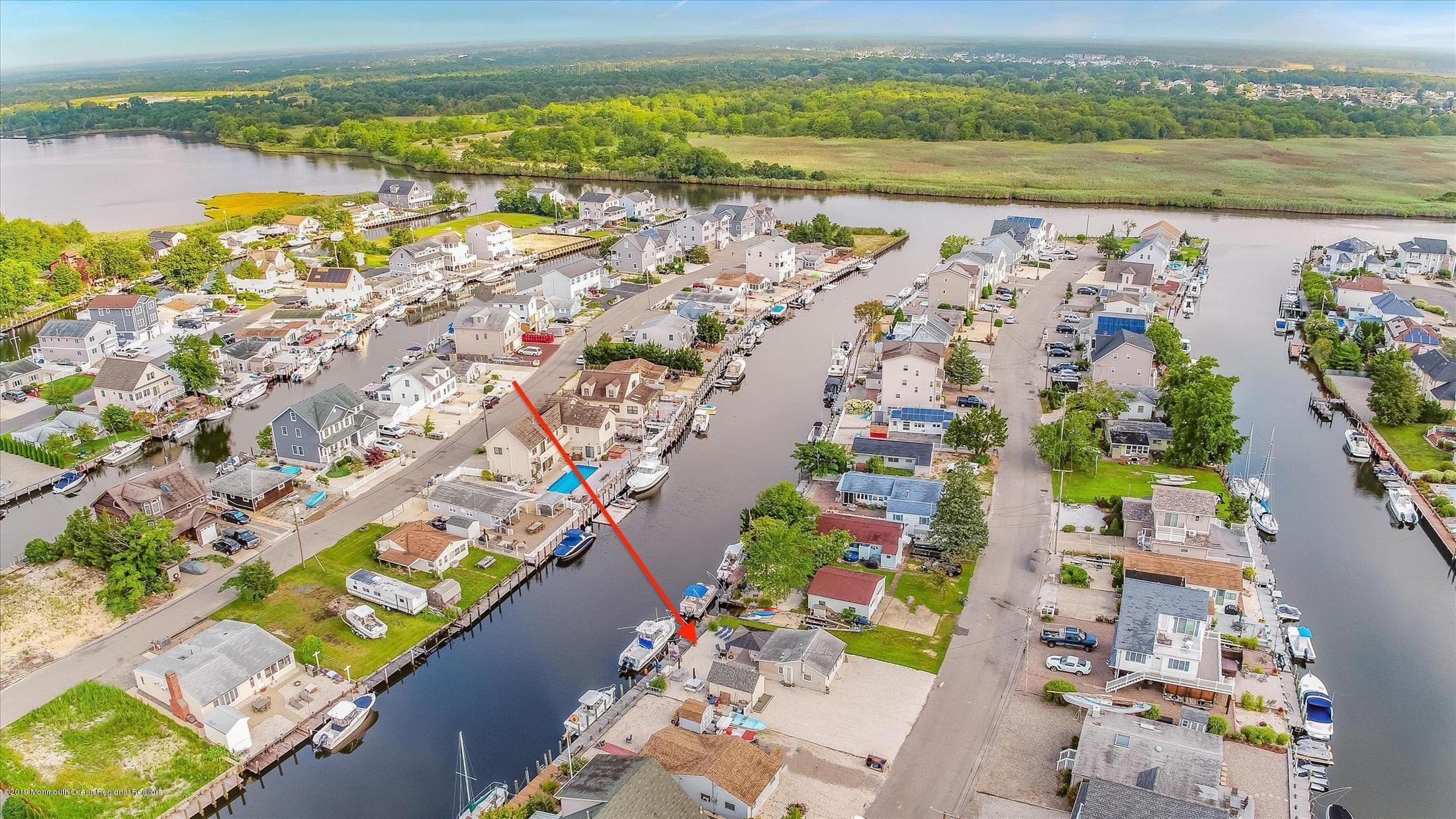 11 Compass Road Waretown, NJ 08758 - Photo 5 of 38 an aerial view of lake and residential houses with outdoor space