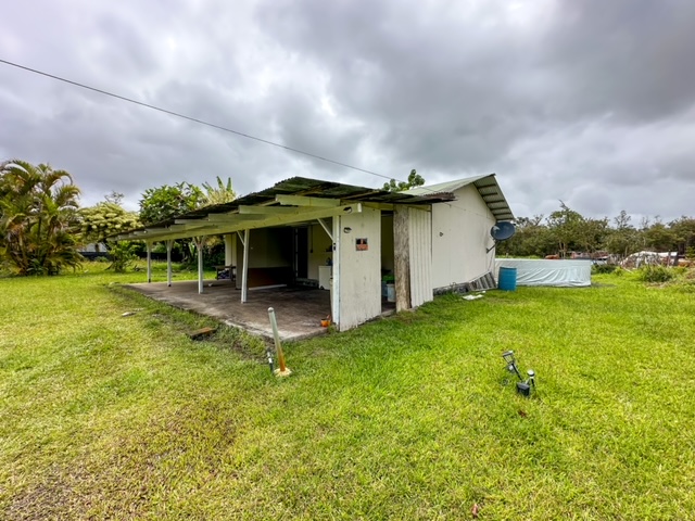 11-3239 4th Street Volcano, HI 96785 - Photo 20 of 22 a front view of a house with garden