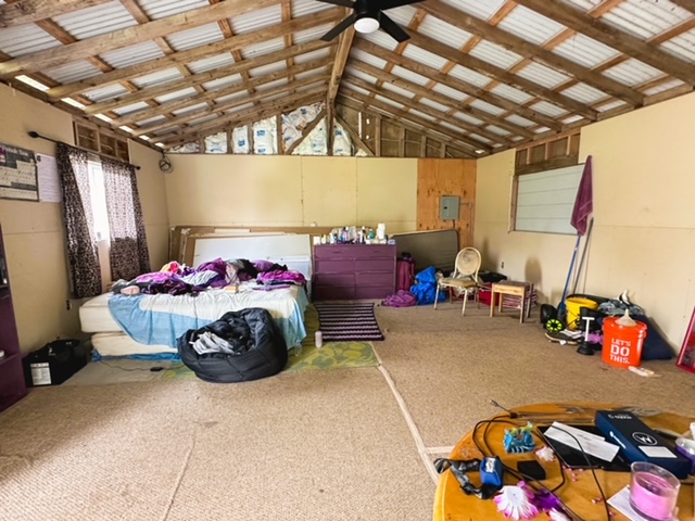 11-3239 4th Street Volcano, HI 96785 - Photo 2 of 22 a bedroom with bed and a chandelier
