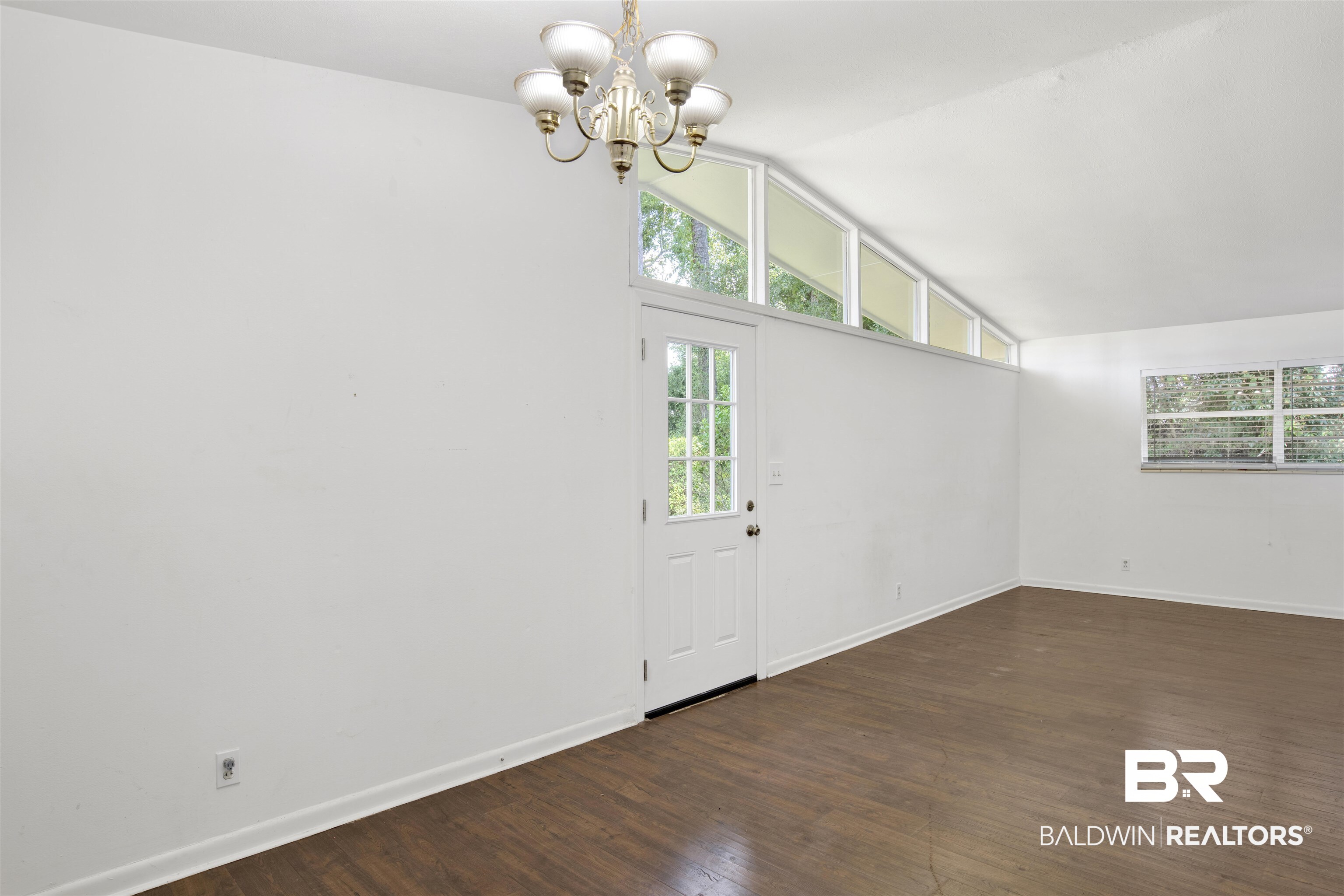 2 Lee Circle Daphne, AL 36527 - Photo 6 of 21 Entryway featuring lofted ceiling, an inviting chandelier, and hardwood / wood-style flooring