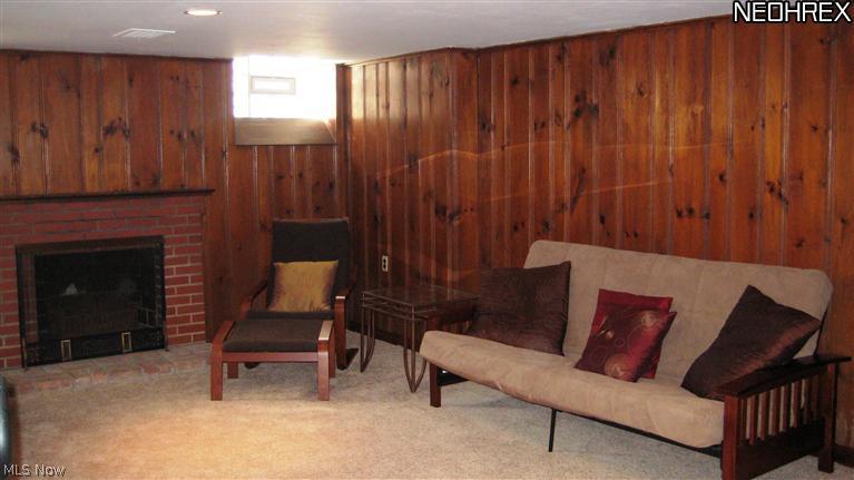 4154 Silsby Road University Heights, OH 44118 - Photo 18 of 18 Lower level has a family room with newer wall-to-wall carpet and fireplace.